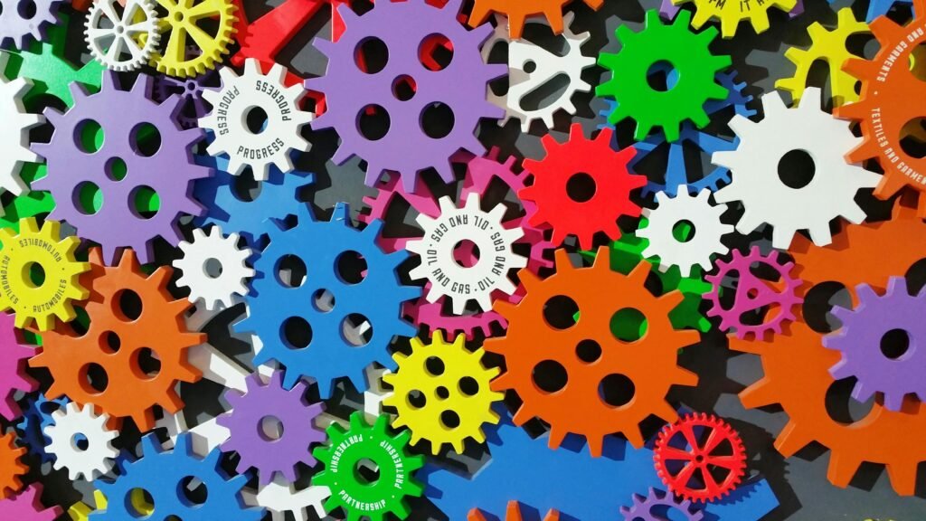 pexels-photo-171198-171198 A colorful arrangement of gears symbolizing creativity, innovation, and machinery in vibrant colors.